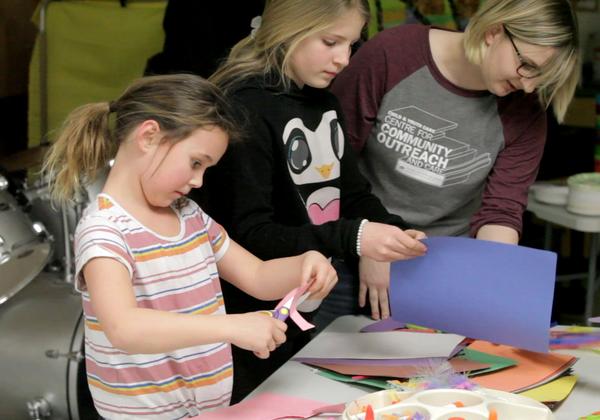 A Student of the Bachelor of Arts in Child and Youth Care program working with two girls