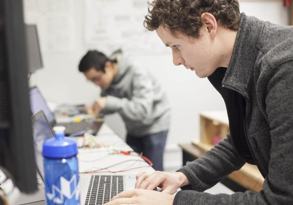 Students of the Bachelor of Arts, Minor in Computing Science program working on laptops