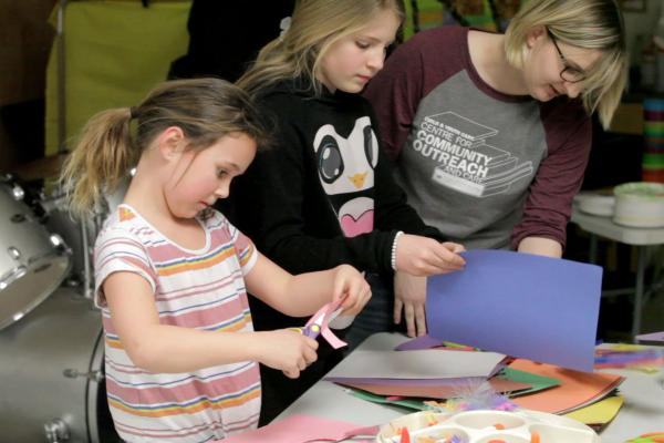 A Student of the Bachelor of Arts in Child and Youth Care program working with two girls