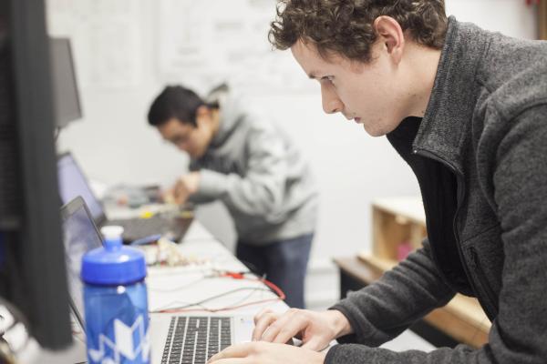 Students of the Bachelor of Arts, Minor in Computing Science program working on laptops