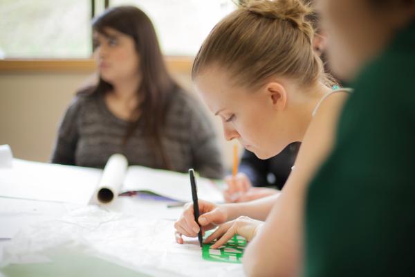 Students of the Interior Design Program drawing a sketch