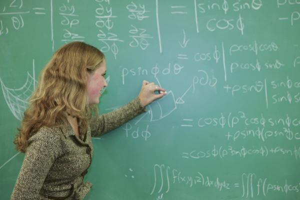 An instructor of the Bachelor of Science, Minor in Mathematics program explaining a calculation