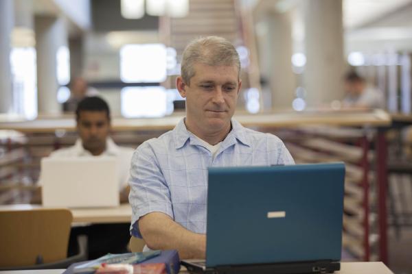 A Student of the BC Adult Graduation Diploma in the library