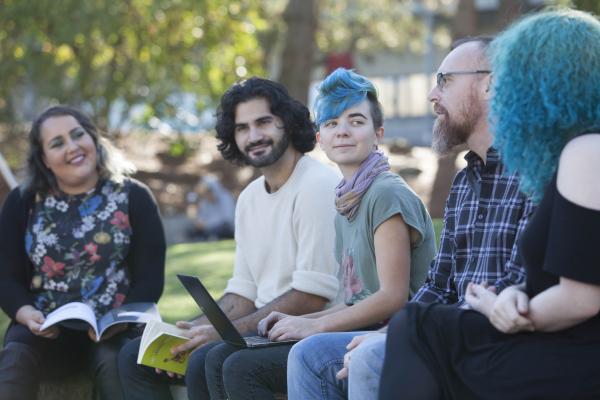 Degree in Journalism students having an outdoor workshop