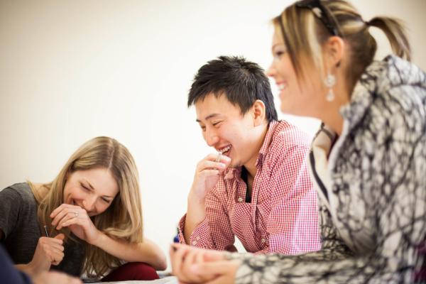 Three students of the Master of Geographic Information Systems Applications program working on a group project