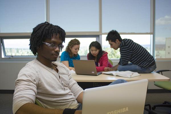 A diverse group of students of the training skills development program at the library