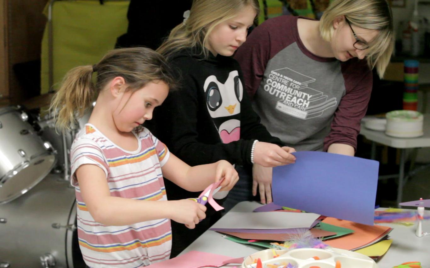 A Student of the Bachelor of Arts in Child and Youth Care program working with two girls