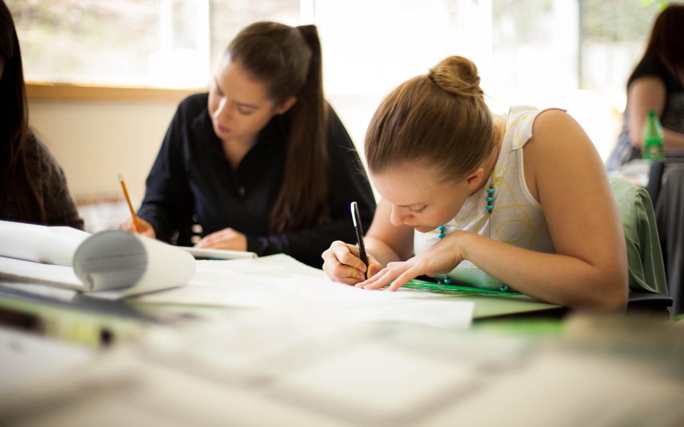 Two female students of the Bachelor of Science, Physics University Transfer Program working on a project