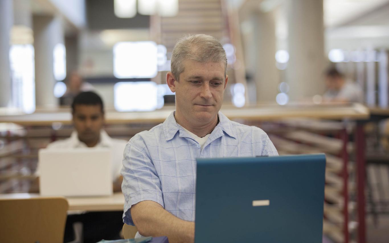 A Student of the BC Adult Graduation Diploma in the library