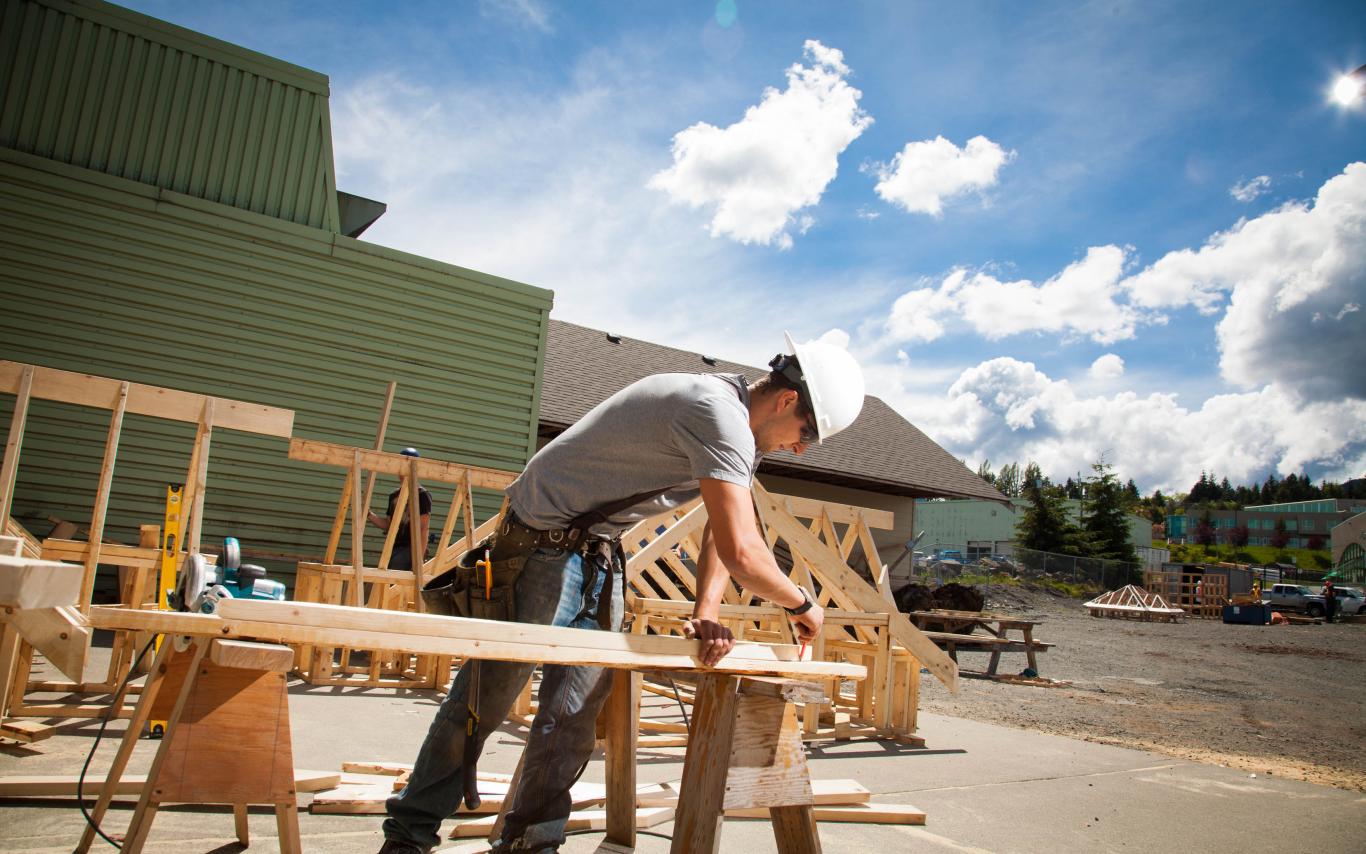 A Carpentry Apprenticeship student working on his wooden project