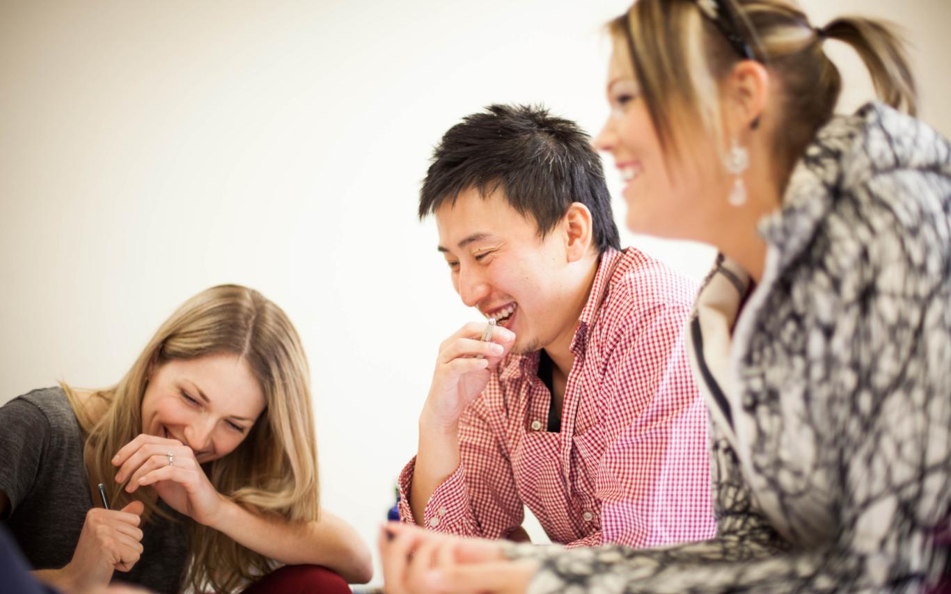 A group of three Culinary Management students having fun at their group project