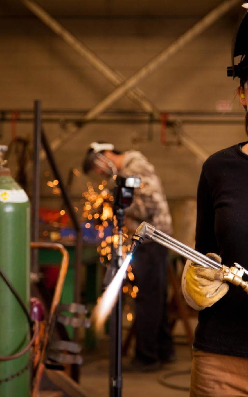 Student holding welding torch