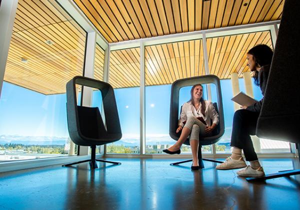 Group of students in modern-looking chairs. 