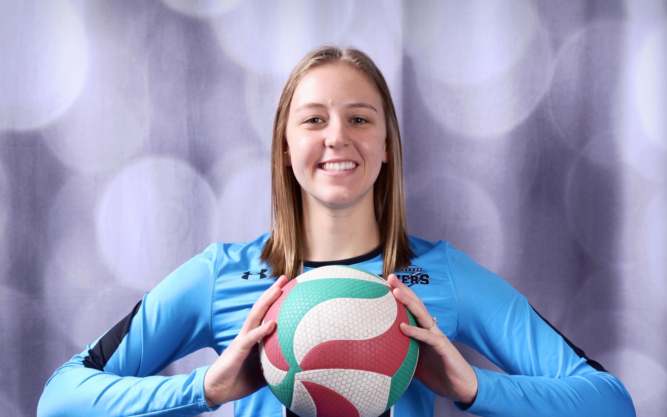 Danielle Groenendijk holding a volleyball.