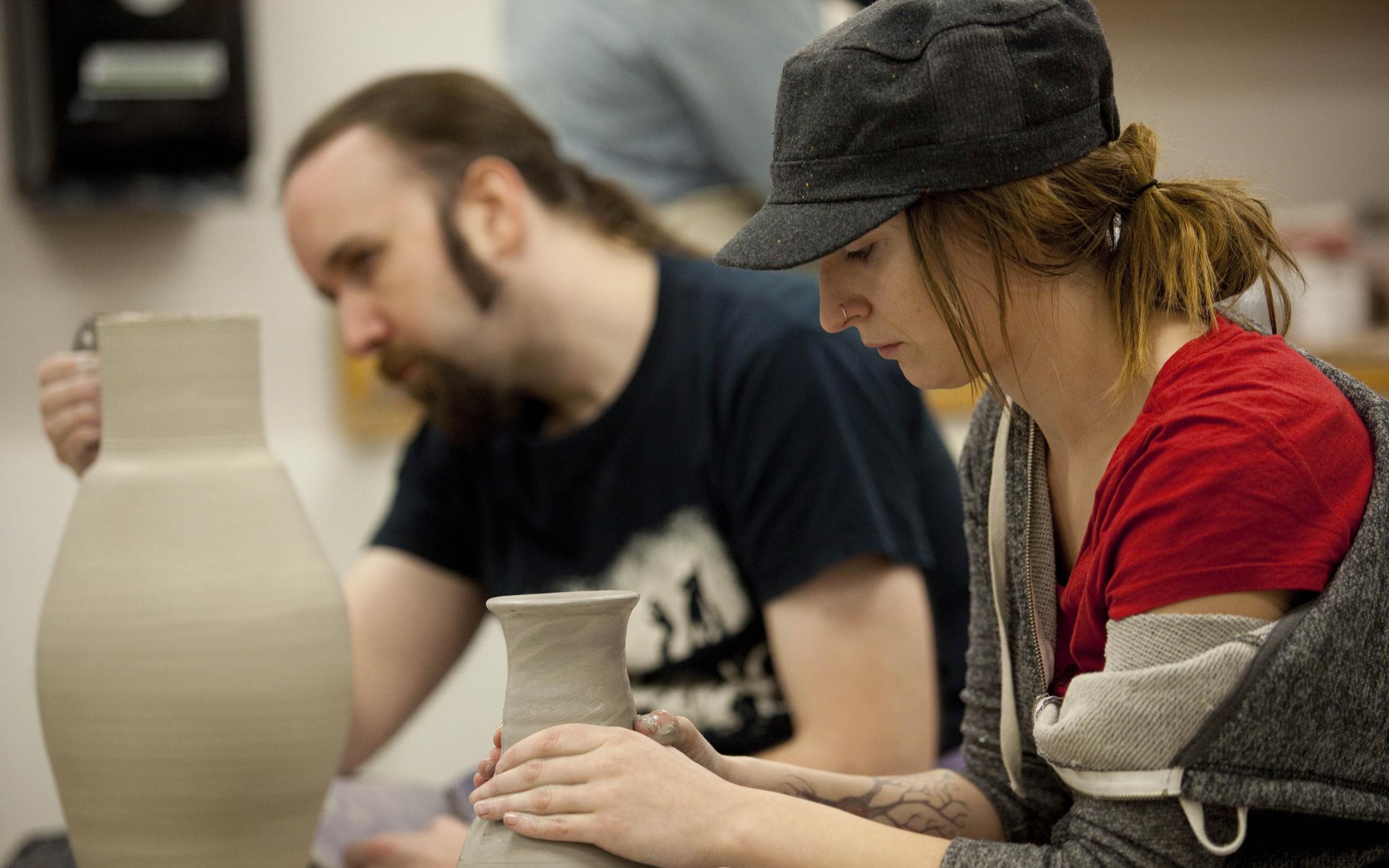 Visual Arts students attending a pottery class
