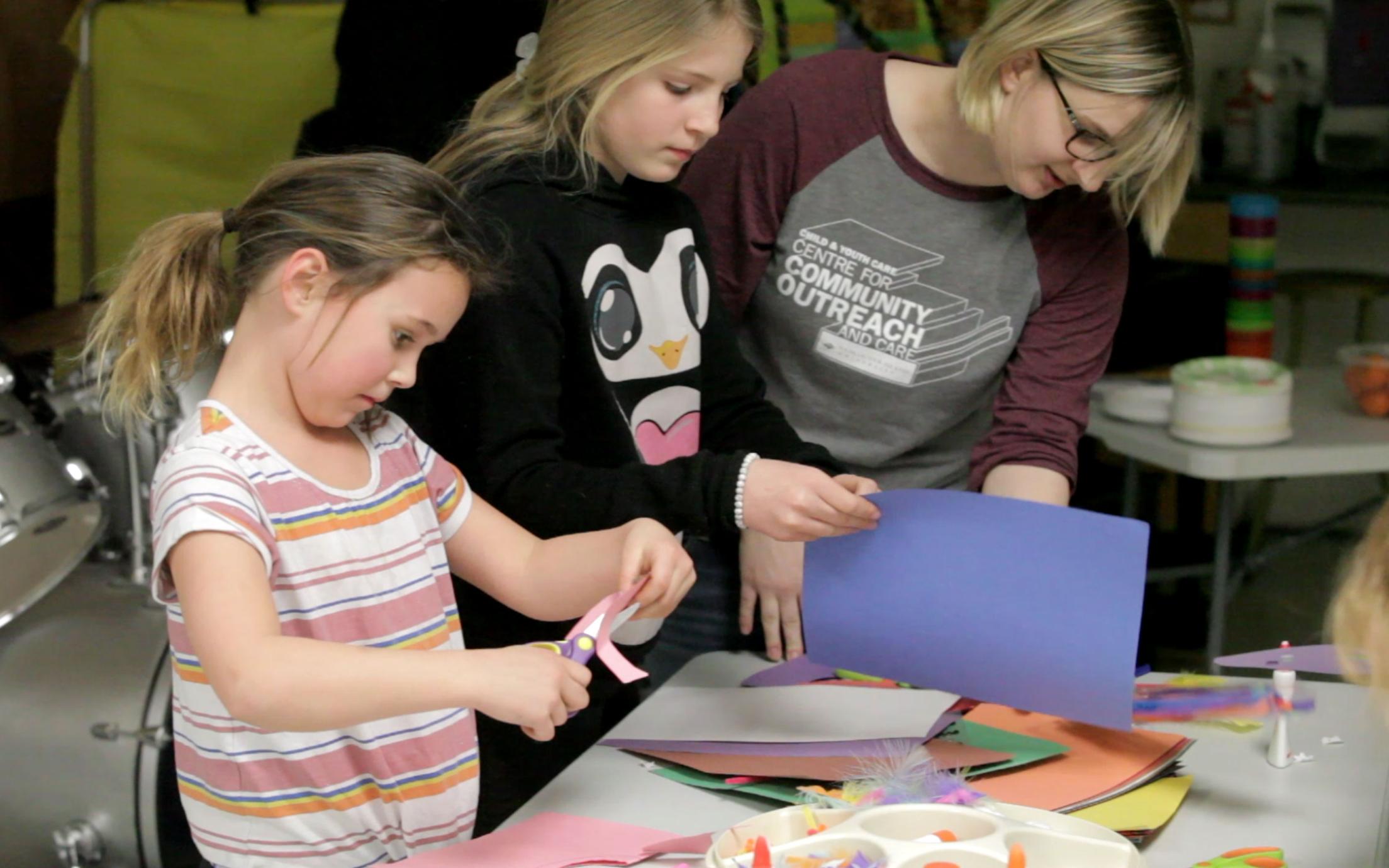 A Student of the Bachelor of Arts in Child and Youth Care program working with two girls