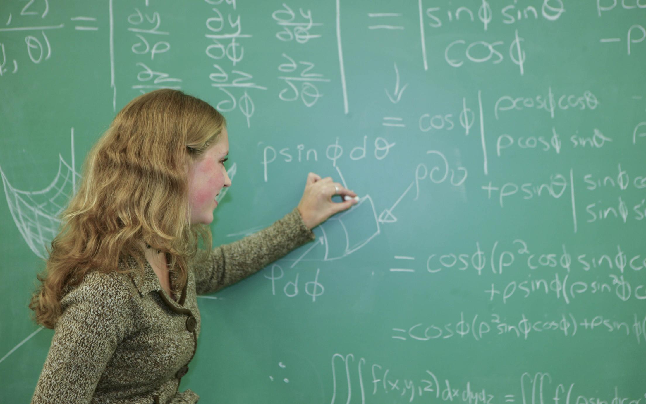 An instructor of the Bachelor of Science, Minor in Mathematics program explaining a calculation