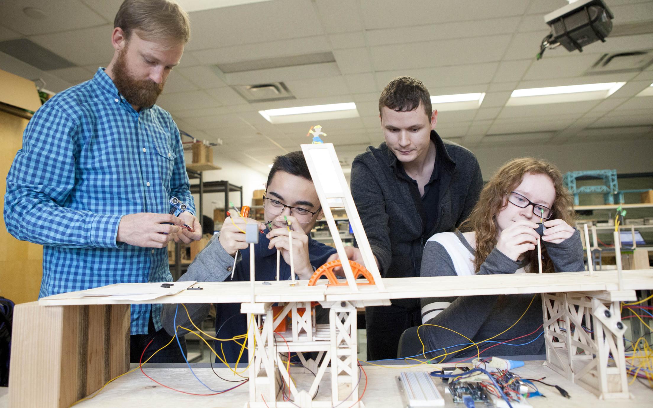 Students of the Fundamentals of Engineering Certificate Program working on a project