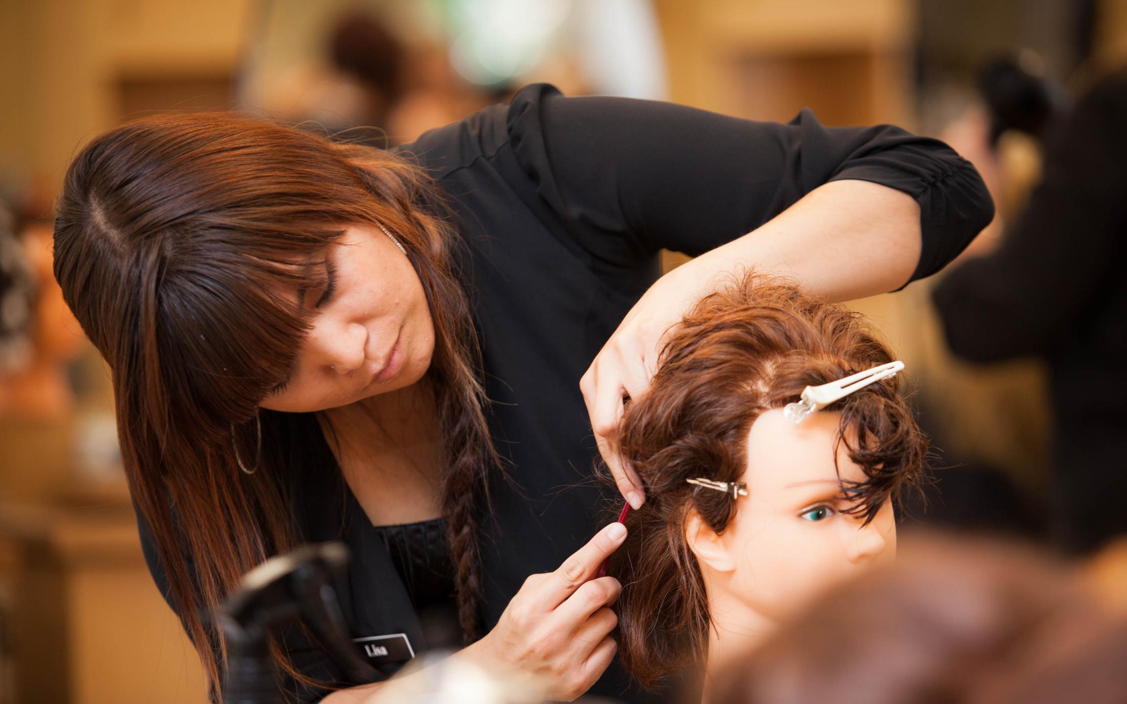 A Hair Stylist course student at VIU's hairdressing school