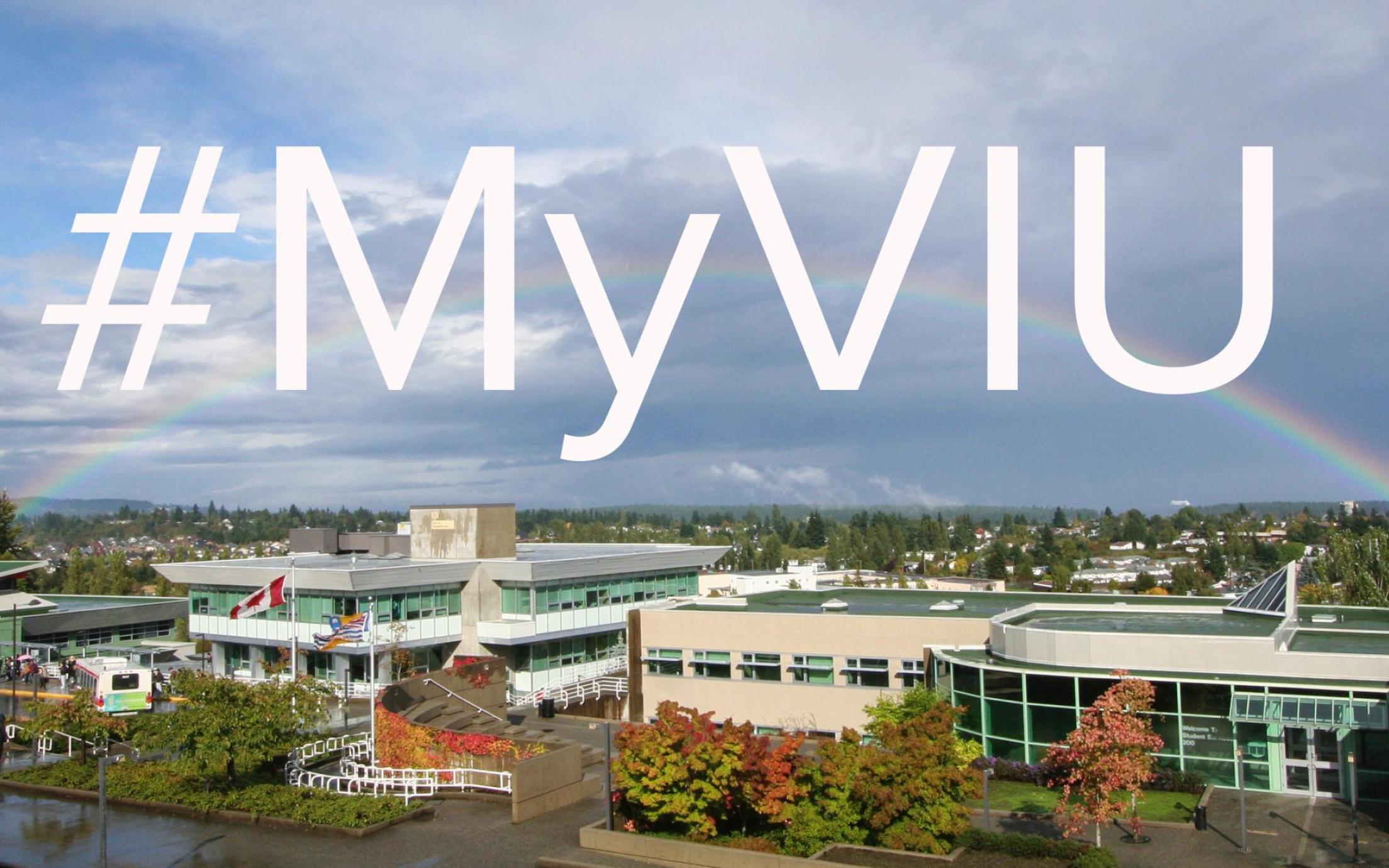 Picture of VIU's Nanaimo campus with a rainbow going across