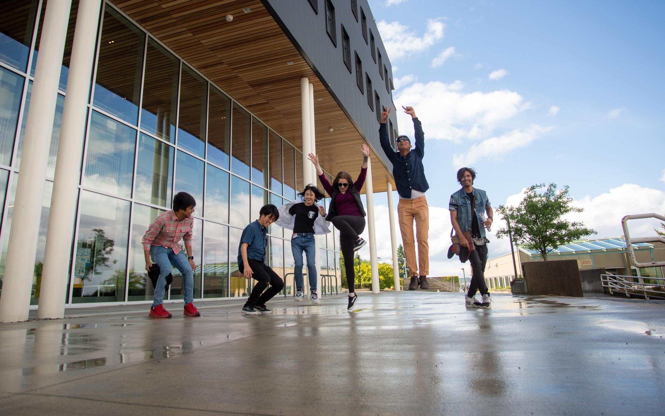 Students jumping outside the Health and Science Centre