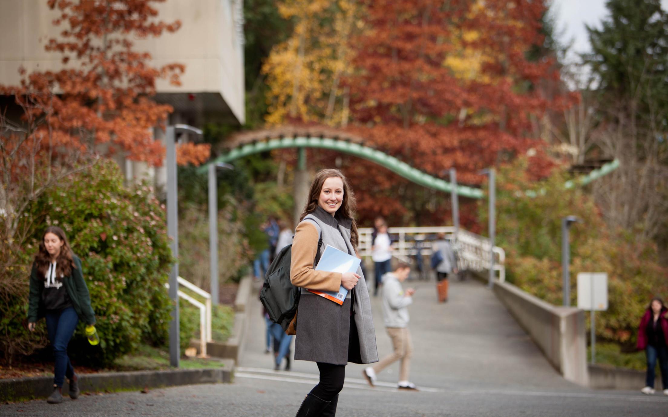 A female Social Services Program student on her way to class