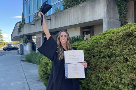 VIU graduate Robyn Doll smiling with diploma
