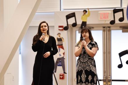 Sarah Hart and Sevilya Hendricks performing a song together at the Chinese Bridge Singing contest at UBC