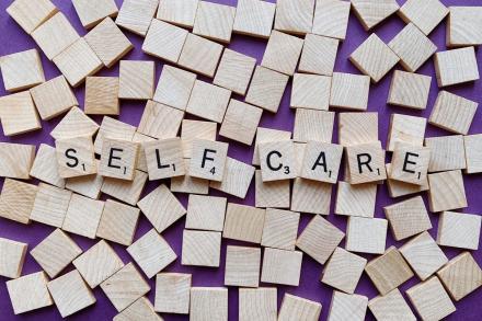 self-care written in scrabble blocks