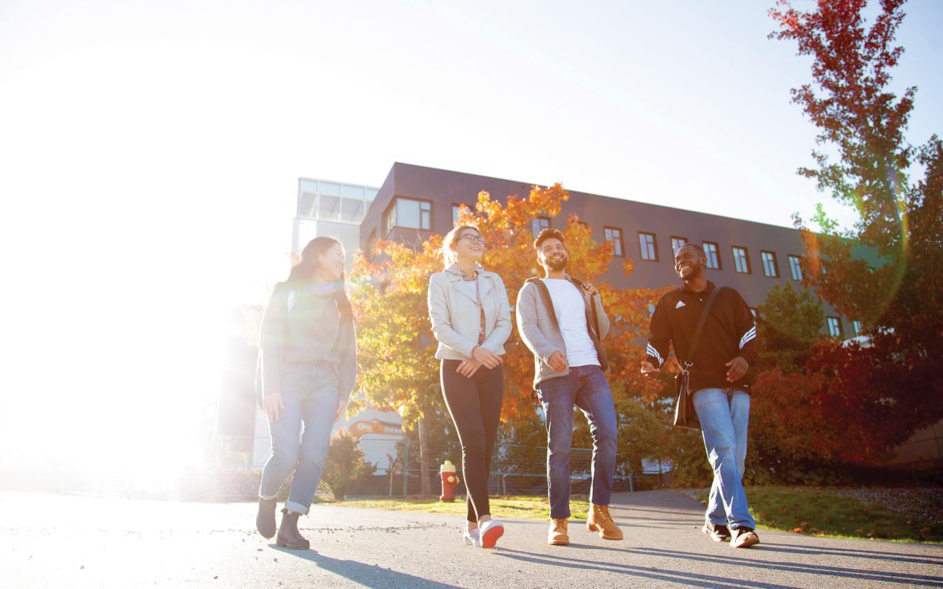 Young people walking in the sunshine.